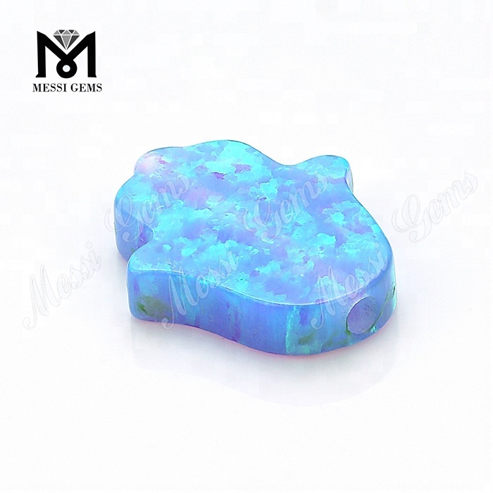 Pierres gemmes synthétiques en vrac de 11 x 13 x 2,5 mm en opale bleue Hamsa créées par le laboratoire